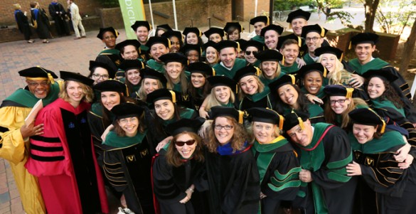School of Medicine graduating students and faculty members gather for a photo following Commencement. (photo by Anne Rayner)