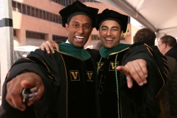 Shanik Fernando, left, and Zain Gowani celebrate after the School of Medicine ceremony at Langford Auditorium. (photo by Anne Rayner)