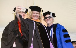 Tiffany Gwartney takes a selfie with Dawn Vanderhoef, Ph.D., DNP, left, and Mavis Schorn, Ph.D., APRN, CNM, at the School of Nursing ceremony. (photo by Susan Urmy)