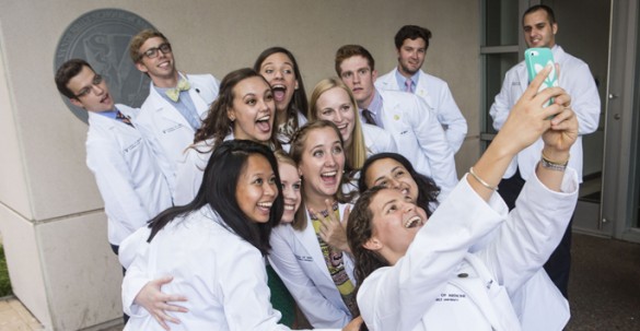 Incoming School of Medicine students gather for a photo outside of Light Hall following last Friday’s White Coat Ceremony. (photo by Anne Rayner)