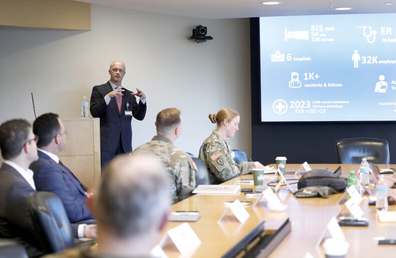 Bradley Dennis, MD, chair of the Vanderbilt Military Affairs Committee and Trauma Medical Director, presents a historical overview of military-civilian partnerships for the Army visitors. (Photo by Donn Jones)