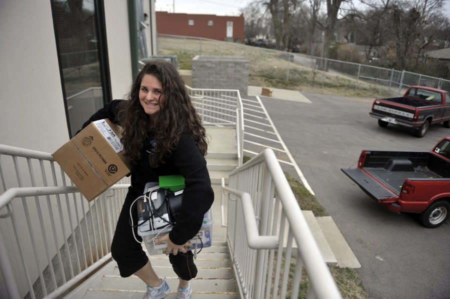Second-year School of Medicine student Paula Marincola helps move the Shade Tree Clinic into its new, larger facility in East Nashville. (photo by Joe Howell)