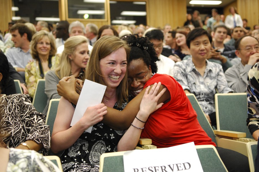Carol Logan, left, is embraced by fellow School of Medicine student Rejoice Opara after learning that she matched at the University of North Carolina Hospitals. (photo by Anne Rayner)