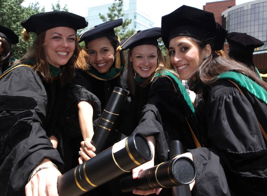 From left, School of Medicine students Sarah Deery, Gabriela Andrade, Katie Ayers and Alia Durrani start the celebration following graduation.