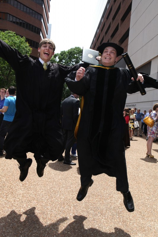 School of Medicine graduate Blake Hooper, right, celebrates with his brother, Peabody graduate Brock. (photo by Anne Rayner)