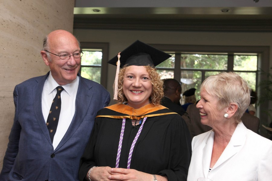 Nursing School student Kate McReynolds shares a moment with her parents, Bob and Margie Bishop. (photo by Susan Urmy)