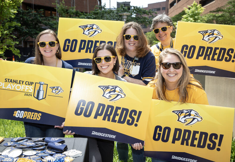 Sarah Lohrmann, MBA, Katie Buntin, Jamie Roberts, Michelle Payne, and Shelly Johnson pose were among those showing their Predators pride on Friday, April 26. (photo by Erin O. Smith)