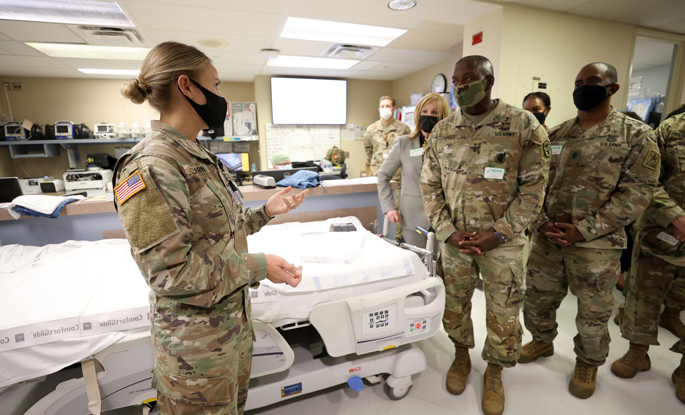 Capt. Kayla Hearn, a critical care nurse in Vanderbilt University Hospital's Trauma Intensive Care Unit, shares her experience as a participant in the U.S. Army Military-Civilian Trauma Team Training with, from left, U.S. Army Medical Command Director of Military-Civilian Partnerships Cynthia Barrigan, U.S. Army Surgeon General and Commanding General of the U.S. Army Medical Command R. Scott Dingle, and U.S. Army Medical Command, Command Sgt. Maj. Diamond D. Hough.