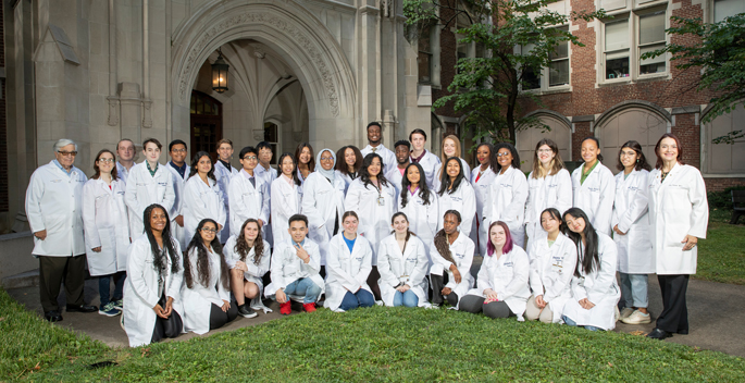 Eighteen high school students and 16 college undergraduates participated in the Aspirnaut program this summer. Program co-founders Billy Hudson, PhD, and Julie Hudson, MD, MA, are at far left and right. Fourth from right, back row, is Aspirnaut alumna Lauren Taylor, from Grapevine, Arkansas, who participated in the inaugural Aspirnaut program 15 years ago — a broadband internet-equipped school bus the Hudsons dubbed their “mobile one-room schoolhouse,” which enabled students to log into science and math lessons during their long bus rides to and from school.