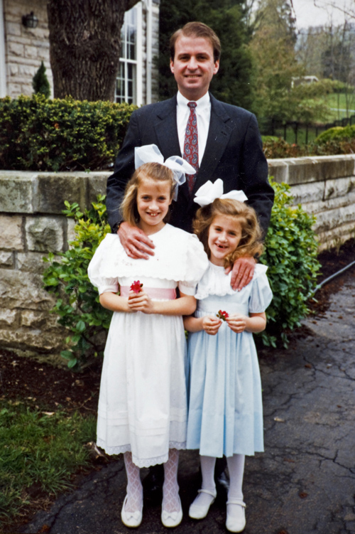 Brock with his now grown daughters, Elizabeth, left, and Grace on an Easter Sunday.