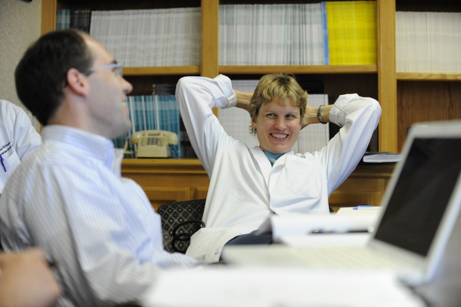Nancy Brown, M.D., shares a laugh with Matt Luther, M.D., and other colleagues during a recent lab meeting in the Robinson Research Building. (photo by Joe Howell)