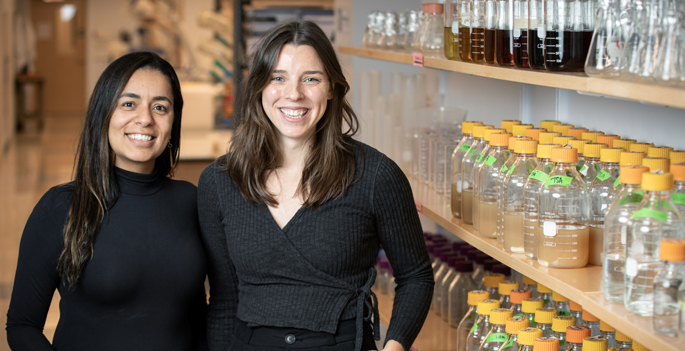 Mariana Byndloss, DVM, PhD, (left), graduate student Catherine Shelton, and their colleagues discovered that beneficial bacteria in the small intestines produce a compound that protects against obesity. (photo by Erin O. Smith)