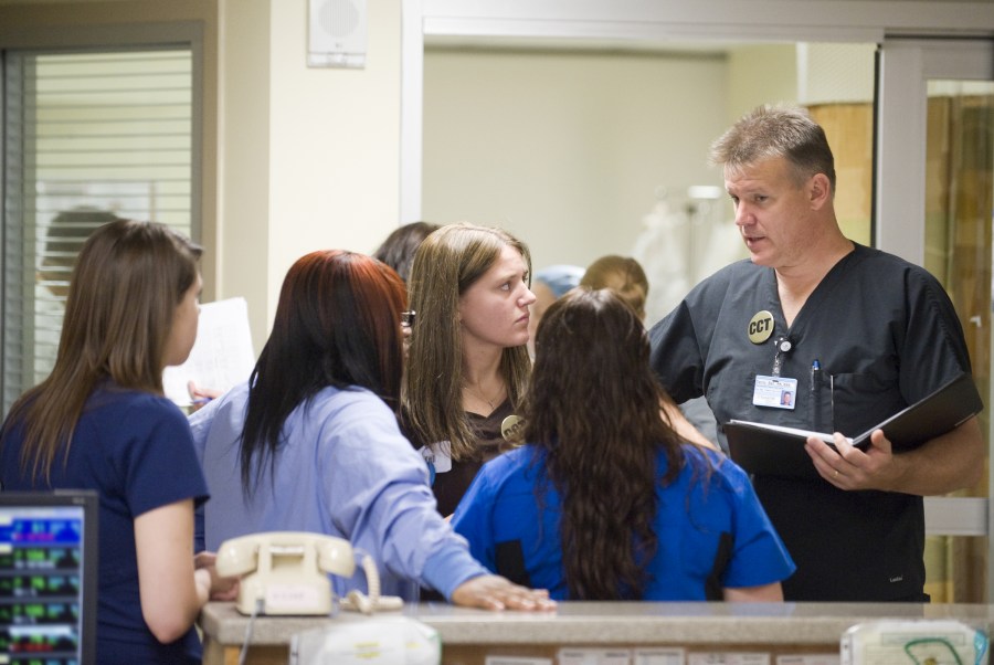 Danny Ball, R.N., right, goes over move logistics in the Neuro Intensive Care Unit with, from left, Shannon Trout, Keantra Smith,  Amber Kimbro and Melody Purvis.