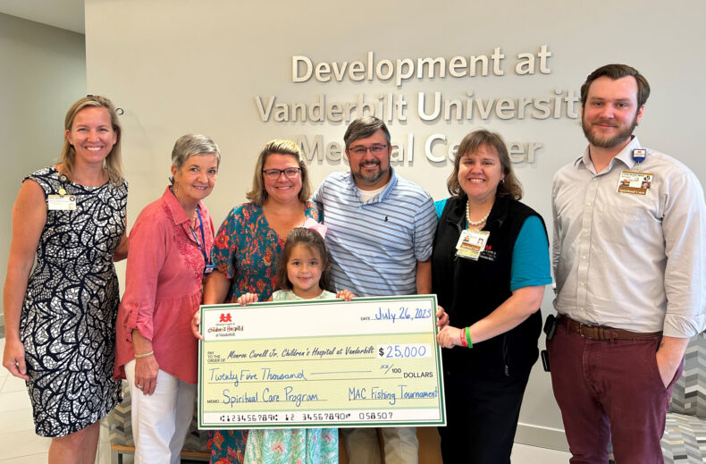 The Carmichael family presents the spiritual care team with funds raised from the 2023 “MAC Sized” Bass Tournament. From left are Jenny Streams, Janet Cross, MEd, CCLS, CPXP, Brandi Carmichael, Caroline Carmichael, Hunter Carmichael, Rev. Lisa Hermann, MDiv, BCC, and Rev. C. Fred Brown, MDiv, BCC. (photo by Jan Duckworth)
