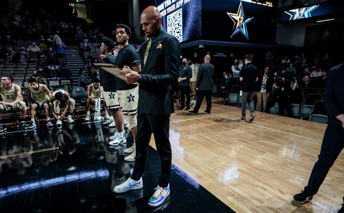 At the Coaches vs. Cancer Vanderbilt Men’s Basketball game, coach Jerry Stackhouse wore one shoe each designed by Children’s Hospital patients Ariana Robinson and Logan Hall. (photo by Truman McDaniel)