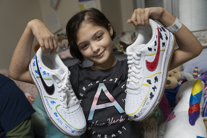 Ariana Robinson decorated her shoes with her cow spots, bedazzled jewles along the soles and her diagnosis, AML Leukemia. (photo by Brian Long)