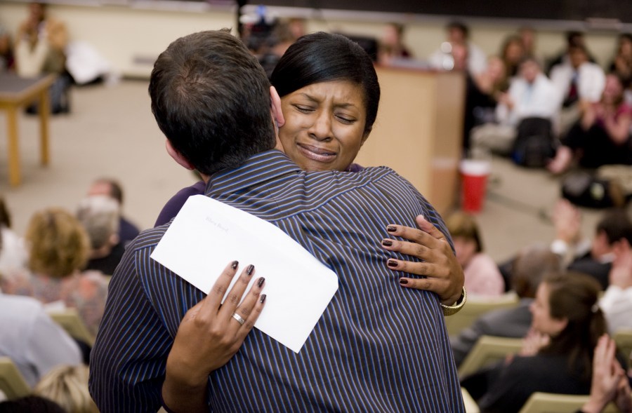 Rhea Boyd gets a hug after learning she matched at UC San Francisco, in Pediatrics. (photo by Joe Howell)