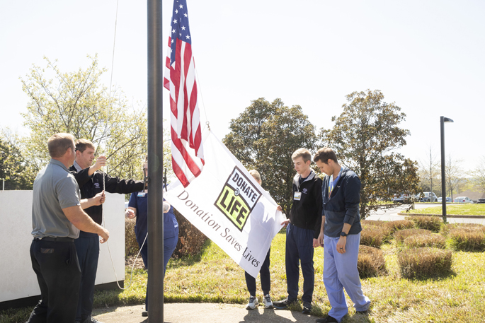 Vanderbilt Wilson County Hospital staff raise the flag at the hospital’s ceremony last week.