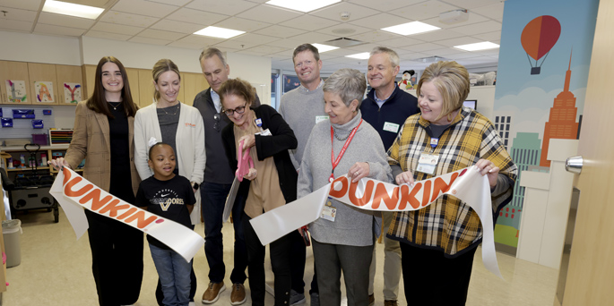 Monroe Carell Jr. Children’s Hospital at Vanderbilt leaders recently celebrate the renovation of a patient playroom along with representatives from Dunkin’ area franchises, the Joy in Childhood Foundation, and patient ambassador, Hannah Kinslow. (photo by Donn Jones)