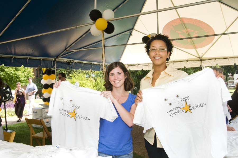 Brittany Darling, left, and Amaris Scott show off their Employee Celebration T-shirts. (photo by Susan Urmy)