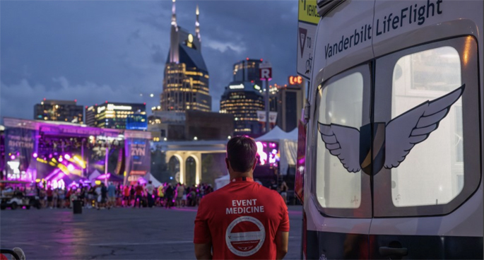 Paramedic Michael Atwood looks at the Nashville skyline while working the Big Machine Music City Grand Prix in August. (photo by Alyssa Smith)