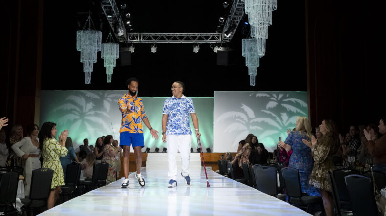 Jeff Johnson and son, Jordan Johnson, a patient of Monroe Carell, walk the runway at Friends & Fashion to a standing ovation from the audience. (photos by Susan Urmy)