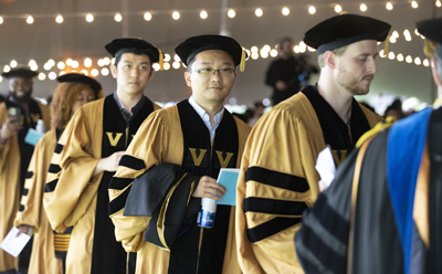 Guochong Jia, center, received his PhD in Epidemiology.