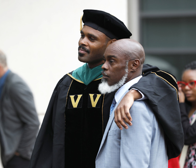 VUSM graduate Kaleel Hatten with his father, James Anthony Davis III.