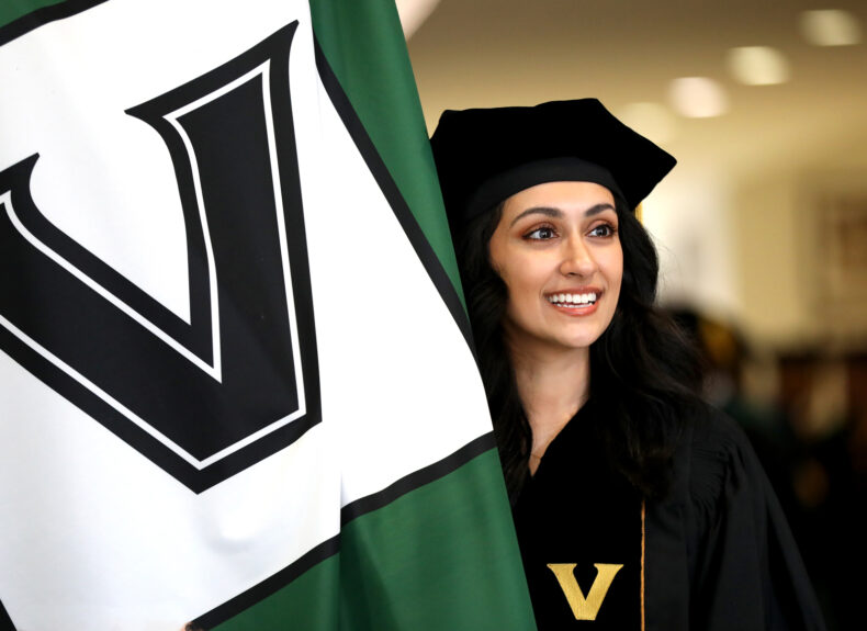 School of Medicine graduate and fourth-year class president Saba Rehman was this year’s flag bearer. (photo by Donn Jones)
