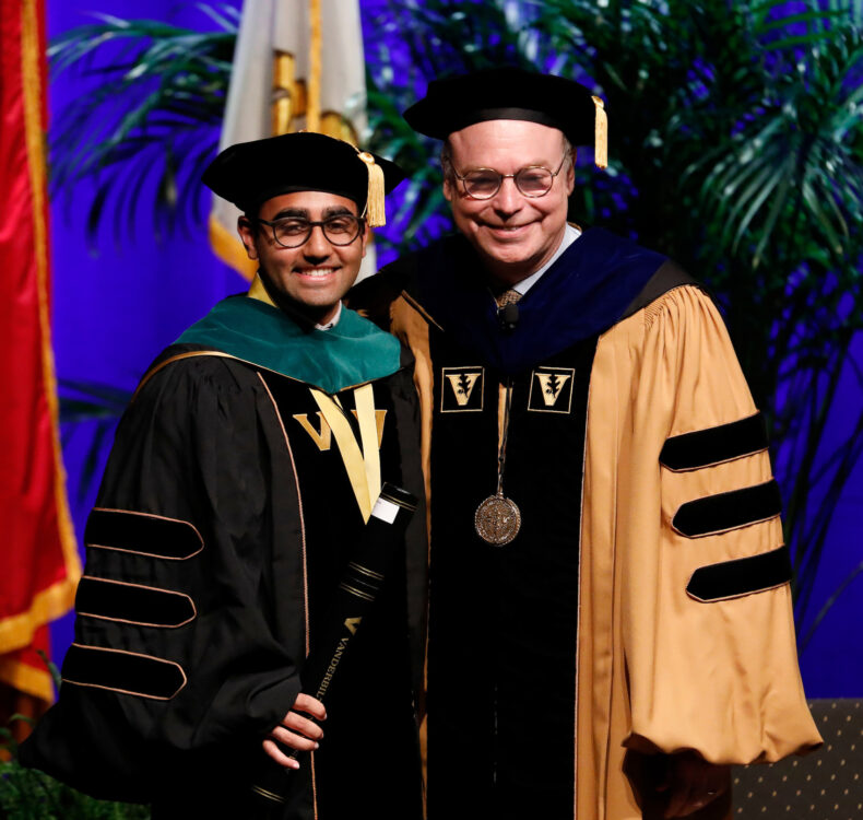 Kumar Aggarwal, MD, here with Jeff Balser, MD, PhD, was named Founder’s Medalist for the School of Medicine. (photo by Donn Jones)