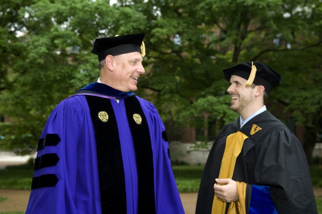 Joe Deweese, right, who received his Ph.D. in Biochemistry, talks with mentor Neil Osheroff, Ph.D., at the Graduate School ceremony. (photo by Susan Urmy)