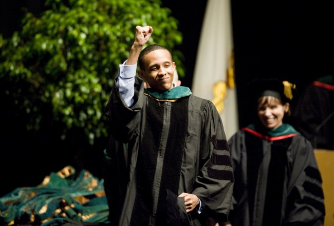 Shamaal Miller celebrates after receiving his degree from the School of Medicine. (photo by Joe Howell)
