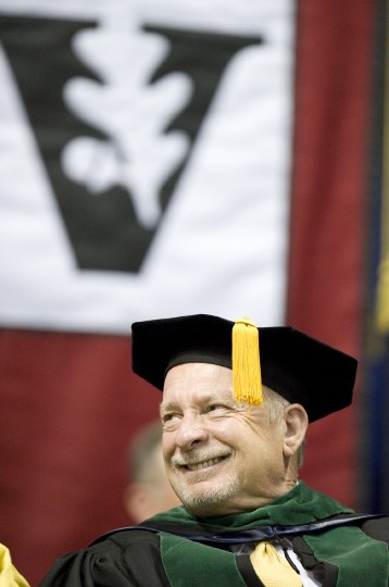 Harry Jacobson, M.D., smiles during the School of Medicine ceremony at Langford Auditorium. (photo by Joe Howell)
