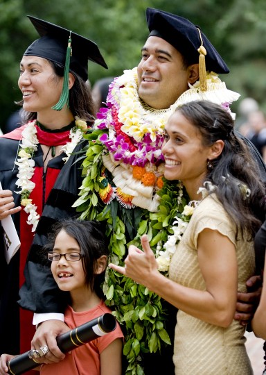 VUSM's Brigham Au, his wife, Anna, right, sister, Kawehi Sekona, and niece, Nele Kaufusi, donned Hawaiian leis at graduation. (photo by Joe Howell)