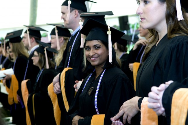 Anna Samuel and School of Nursing classmates listen to speakers at commencement. (photo by Susan Urmy)