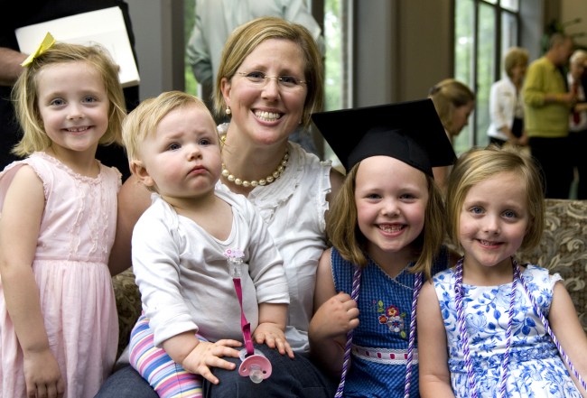 Following the School of Nursing ceremony, Laurie Ford relaxes with her daughters, from left, Emma, Sadie, Bella and Madeline. (photo by Susan Urmy)