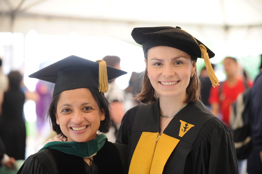 Maria Alfaro, right, with her mentor, Pampee Young, M.D., Ph.D., at the Graduate School ceremony. (photo by Joe Howell)