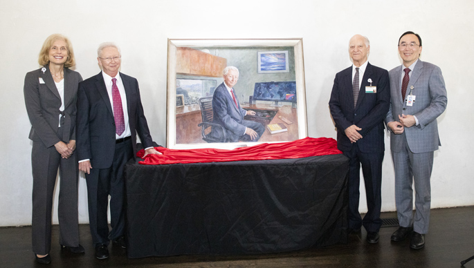 The anniversary celebrations included the unveiling of a portrait of Frank Harrell, phD, second from left, here with Jennifer Pietenpol, PhD, Gordon Bernard, MD, and Yu Shyr, PhD. (photo by Susan Urmy)
