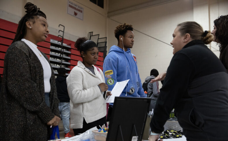 Pearl-Cohn High School students Mia Moshay, 18, Katiea Brooks, 18, and Kyler Garcia, 16, speak with VUMC’s Lindsey Storm, CPhT-Adv, CPST, and Terry Bossen, PharmD, during the Health Care Career Day Fair at Pearl-Cohn High School. (photo by Erin O. Smith)