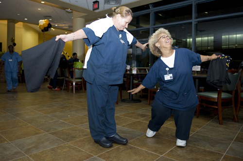 Refka Bacevac, left, and Jearldine Tucker, with environmental services, dance during Night Owl Howl. (photo by Joe Howell)