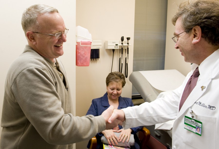 Jimmy Williams and his wife, Ruth, talk with Robert Miller, M.D., who diagnosed Williams’ condition.