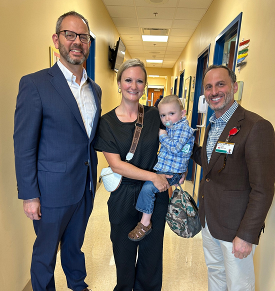 Hope Jenné and her son, Judge, with Jay Wellons, MD, MSPH, left, and Michael Golinko, MD..