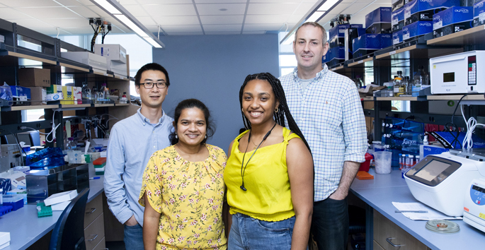 From left, Xiang Ye, PhD, Suba Rajendren, PhD, Antiana Richardson, and John Karijolich, PhD, are studying how the cancer-causing virus KSHV commandeers host gene expression and regulatory machinery.