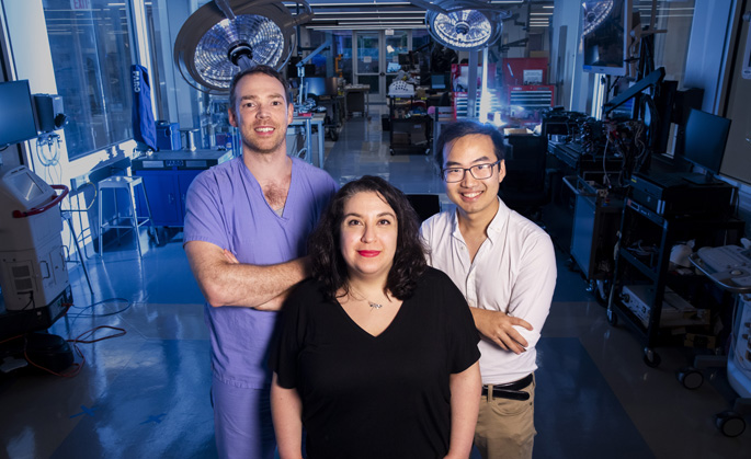 A Vanderbilt Institute for Surgery and Engineering team working to create a navigational system to decrease stone fragments left behind after surgery includes Nicholas Kavoussi, MD, left, Ipek Oguz, PhD, and Daiwei Lu. (photo by Susan Urmy)