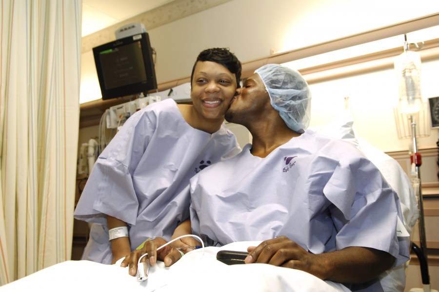 Lee gives Beckwith a kiss before heading to the OR for the Valentine’s Day transplant surgery. (photo by Anne Rayner)