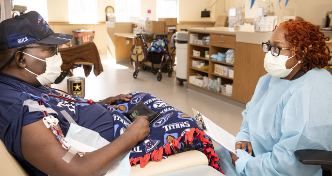 Toddra Liddell, APRN, FNP-C, PMHNP-BC, right, works with patient Steven Buchanan at Vanderbilt Dialysis Clinic – East. (photo by Susan Urmy)