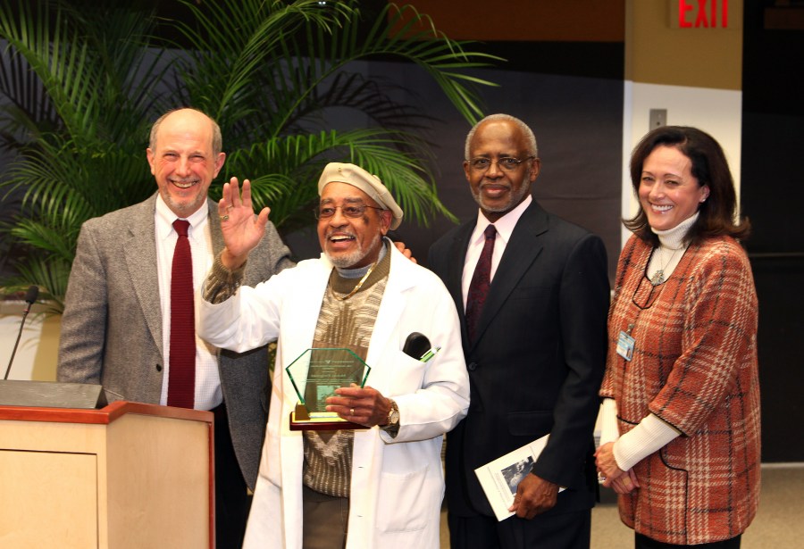 Longtime Department of Biochemistry employee Melvin Fitzgerald, second from left, received this year’s Dr. Martin Luther King Jr. Award at Monday’s event celebrating King’s life and legacy. On hand were, from left, F. Peter Guengerich, Ph.D., George Hill, Ph.D., and Jana Lauderdale, Ph.D., R.N. (photo by Susan Urmy)