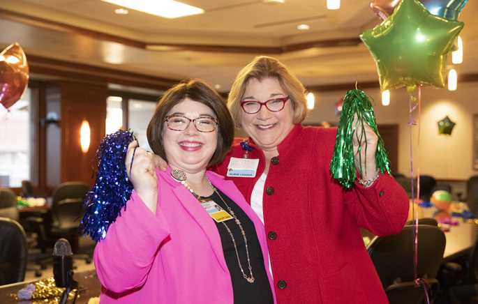Ashley Ried, MMHC, RN, CPPS, left and Kathie Krause, MSN, RN, NNP-BC, NEA-BC, celebrate the Magnet designation announcement at Monroe Carell Jr. Children’s Hospital at Vanderbilt. (photo by Erin O. Smith)