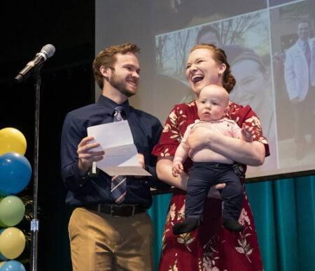 Landon Fike celebrates with his wife, Kennedy, and son, Asher, after learning he’ll stay at Vanderbilt for his residency. (photo by Susan Urmy)