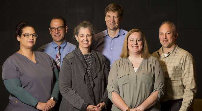 Researchers on the NCI Moonshot grant focused on hereditary cancers include (front row, from left) Natasha Celaya-Cobbs, LPN, Georgia Wiesner, MD, Sarah Bland, MPH, MBA, (back row, from left) Trent Rosenbloom, MD, Josh Peterson, MD, MPH, and Marc Beller, PMP, BA.